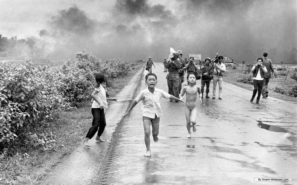 Vietnamese children fleeing from the smoke (possibly napalm).