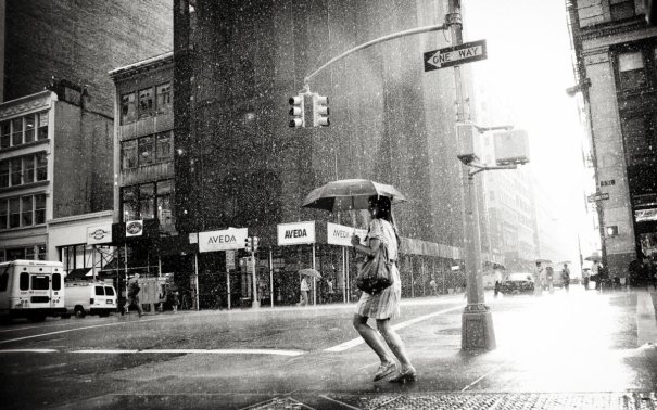 Girl walking in the rain.