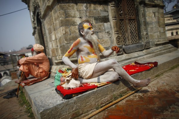 Hindu holy man resting at a temple.