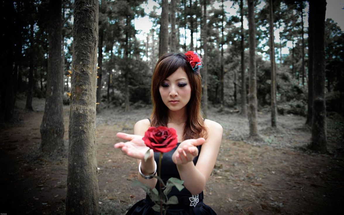 Asian woman with rose