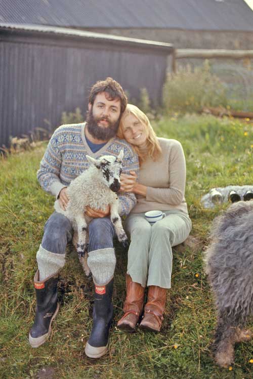 Paul McCartney and Linda McCartney poses with a lamb on their farm in Mull of Kintyre, 1970.