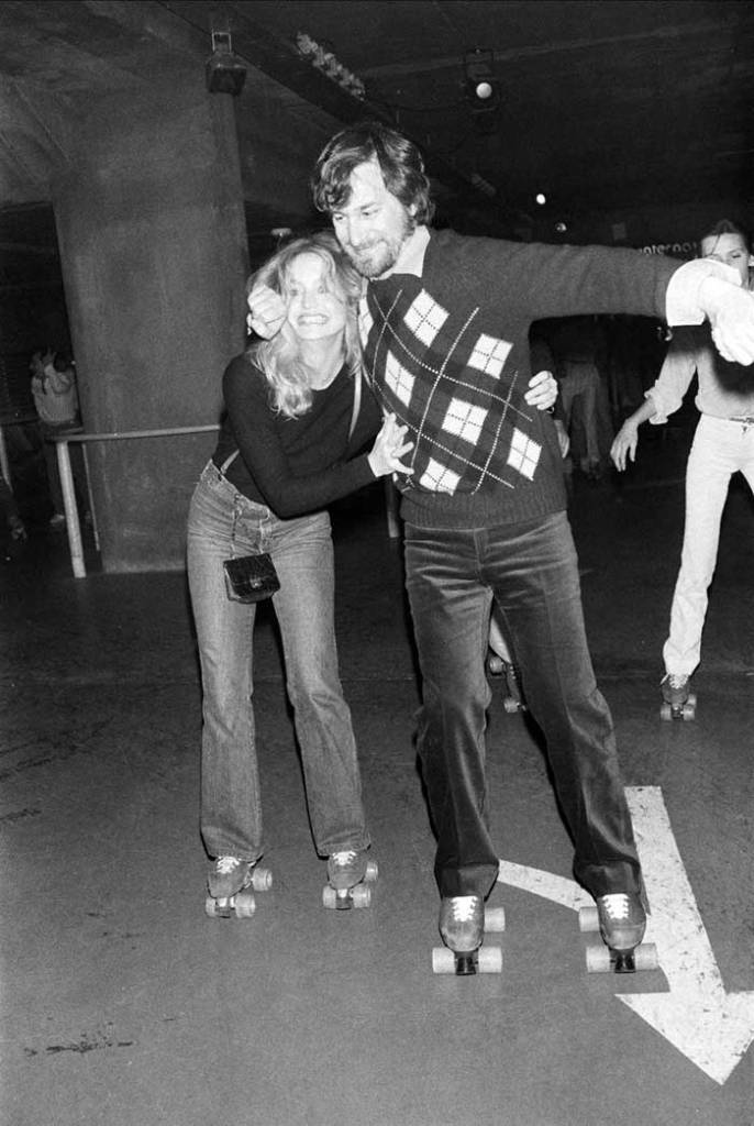 Goldie Hawn and Steven Spielberg roller skating, 1980.