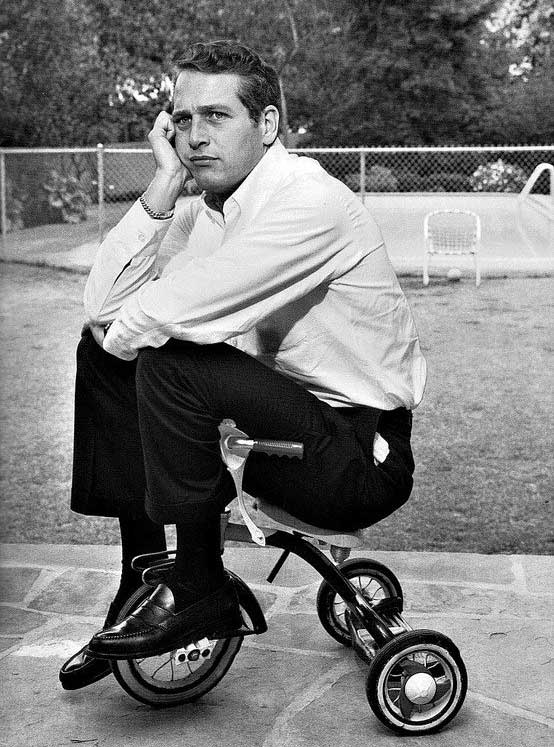 Paul Newman on a tricycle.