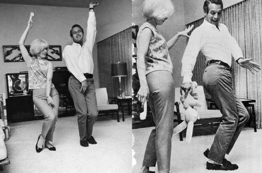 Joanne Woodward and Paul Newman showing off some dance moves.